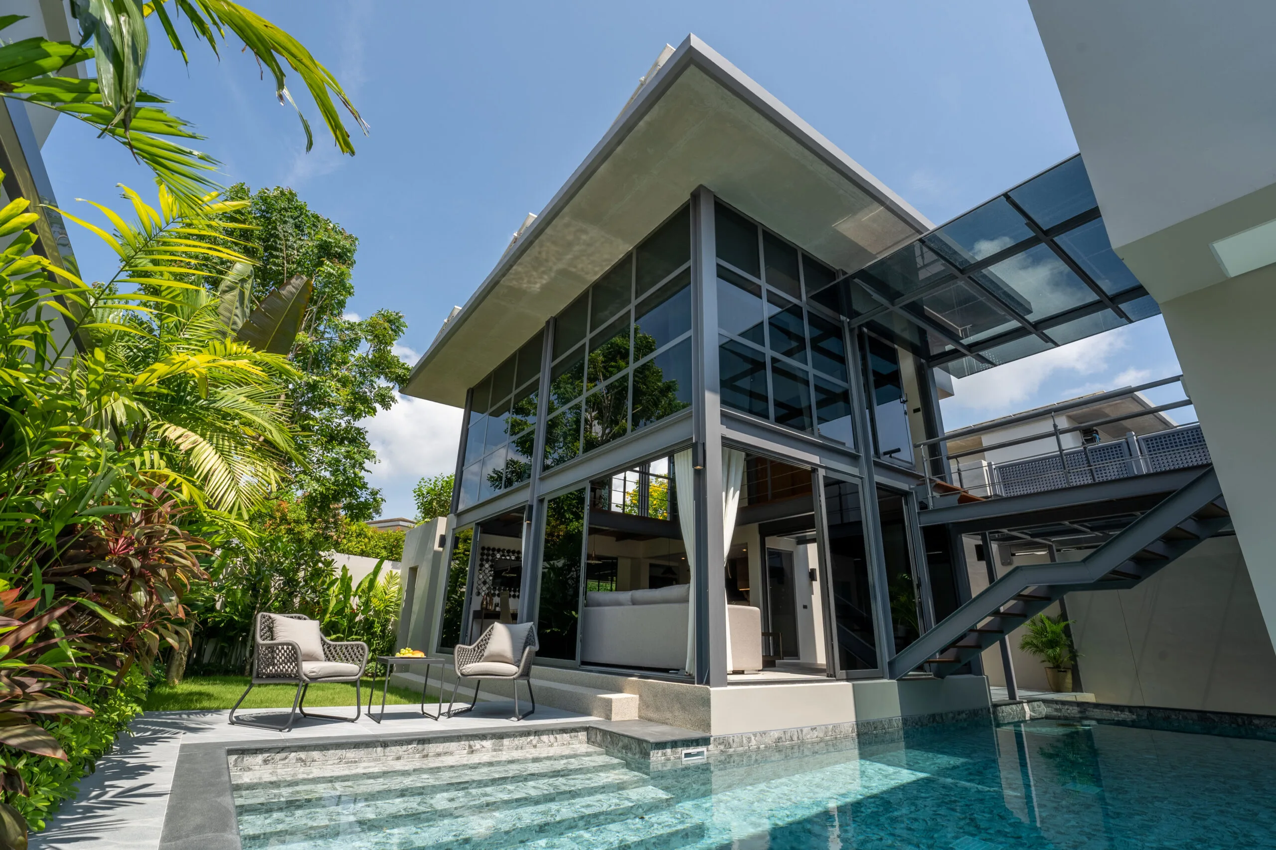 Modern solar powered 3-bedroom pool villa in Phuket with loft-style design, large glass windows and private swimming pool
